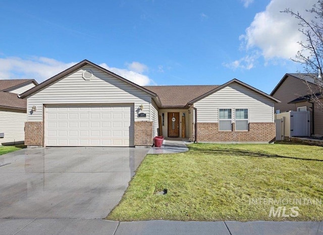 ranch-style home featuring a garage, driveway, a front yard, and brick siding