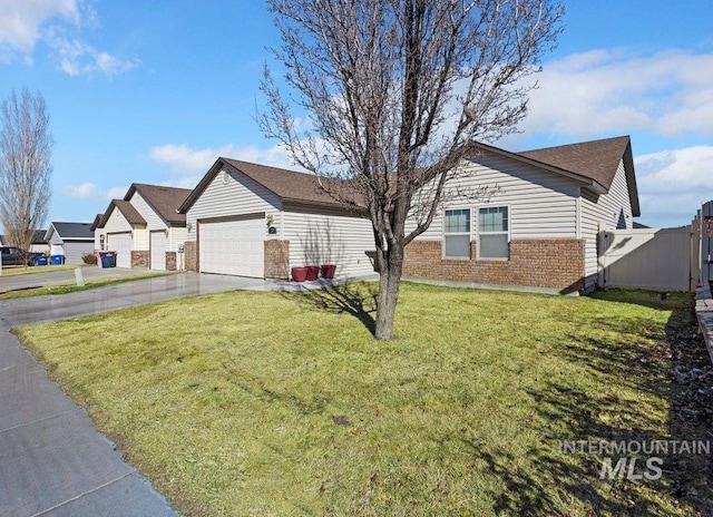 single story home featuring a garage, brick siding, fence, driveway, and a front yard