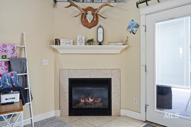 details with a fireplace and baseboards