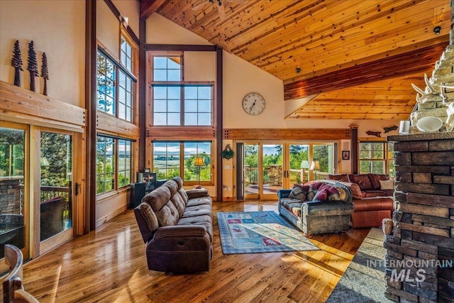 3872 Brookside Dr, New Meadows, ID 83654 - living area featuring high vaulted ceiling, wood finished floors, wood ceiling with exposed beams, and healthy amount of natural light