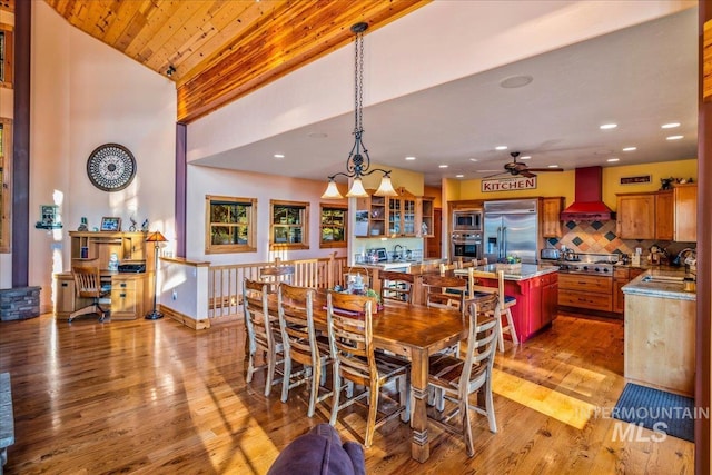 3872 Brookside Dr, New Meadows, ID 83654 - dining space with ceiling fan, high vaulted ceiling, light wood-type flooring, recessed lighting, and a chandelier