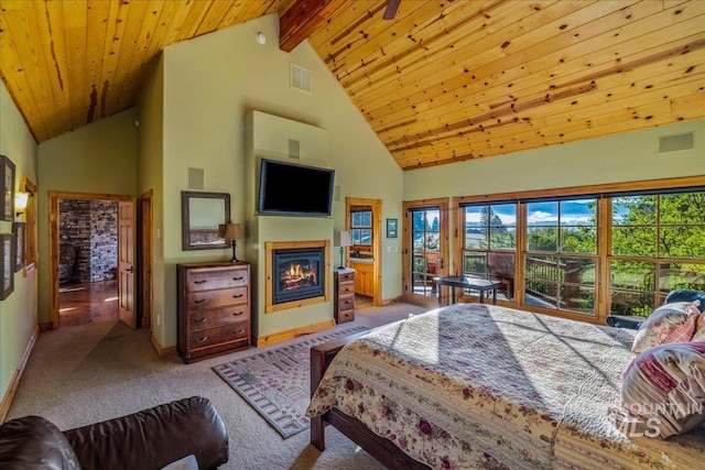 3872 Brookside Dr, New Meadows, ID 83654 - bedroom with a glass covered fireplace, carpet flooring, high vaulted ceiling, wood ceiling with exposed beams, and access to outside