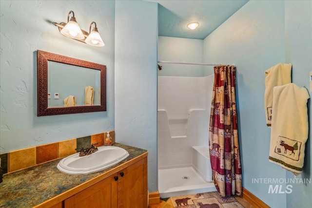 3872 Brookside Dr, New Meadows, ID 83654 - bathroom featuring tiled shower and vanity