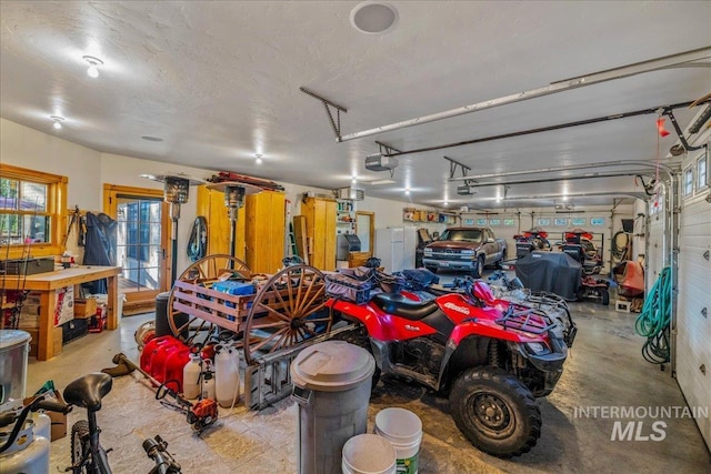 3872 Brookside Dr, New Meadows, ID 83654 - garage featuring a garage door opener