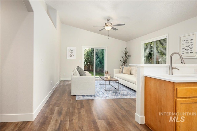4112 W Cherrytree Ct, Meridian, ID 83642 - living room with lofted ceiling, dark wood-style flooring, a ceiling fan, and baseboards