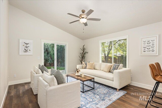 4112 W Cherrytree Ct, Meridian, ID 83642 - living area featuring ceiling fan, baseboards, healthy amount of natural light, dark wood finished floors, and vaulted ceiling