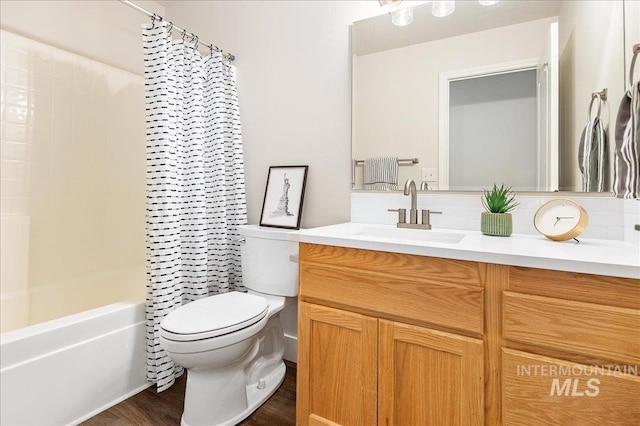 4112 W Cherrytree Ct, Meridian, ID 83642 - full bath with toilet, vanity, wood finished floors, shower / bath combo with shower curtain, and backsplash