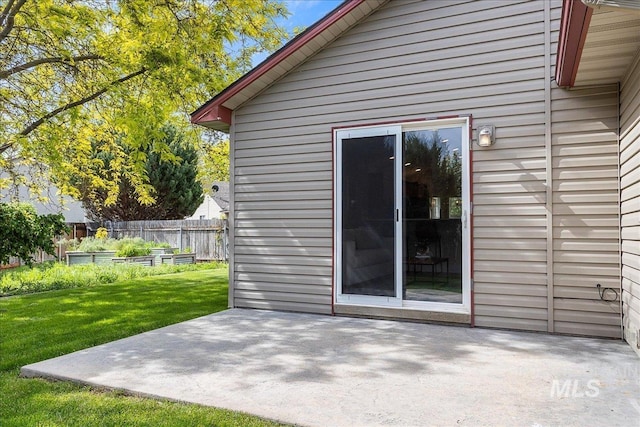4112 W Cherrytree Ct, Meridian, ID 83642 - back of house with a vegetable garden and a patio