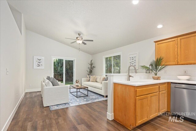 4112 W Cherrytree Ct, Meridian, ID 83642 - living room featuring healthy amount of natural light, a ceiling fan, lofted ceiling, dark wood-type flooring, and recessed lighting