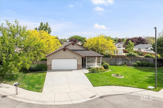 4112 W Cherrytree Ct, Meridian, ID 83642 - view of front of house featuring a garage, driveway, and stone siding