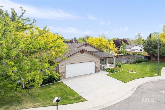 4112 W Cherrytree Ct, Meridian, ID 83642 - view of front facade featuring driveway, stone siding, and a garage