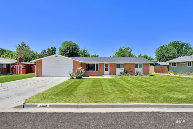 3308 Iowa Ave, Caldwell, ID 83605 - single story home featuring brick siding, a garage, and driveway