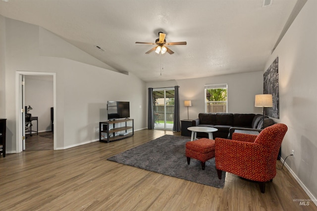 3422 Vistapark Dr, Caldwell, ID 83605 - living room with ceiling fan, wood finished floors, baseboards, and lofted ceiling