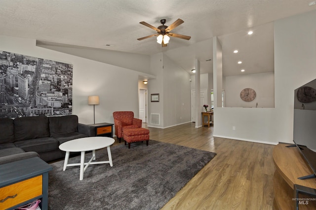 3422 Vistapark Dr, Caldwell, ID 83605 - living room featuring wood finished floors, a ceiling fan, vaulted ceiling, baseboards, and recessed lighting
