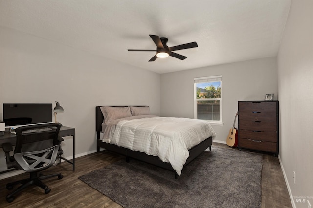 3422 Vistapark Dr, Caldwell, ID 83605 - bedroom featuring dark wood-style flooring, baseboards, and a ceiling fan