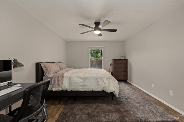 3422 Vistapark Dr, Caldwell, ID 83605 - bedroom with dark wood finished floors, ceiling fan, and baseboards