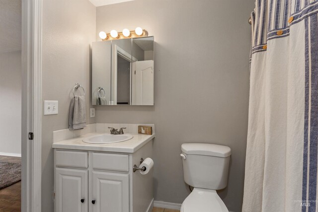 3422 Vistapark Dr, Caldwell, ID 83605 - bathroom featuring toilet, vanity, and baseboards
