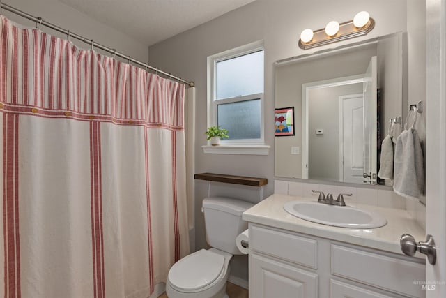 3422 Vistapark Dr, Caldwell, ID 83605 - full bathroom with vanity, toilet, and a shower with shower curtain