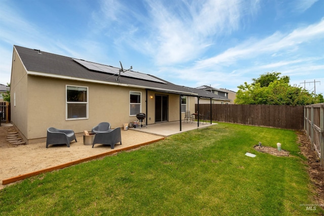 3422 Vistapark Dr, Caldwell, ID 83605 - back of property featuring solar panels, a patio, and stucco siding