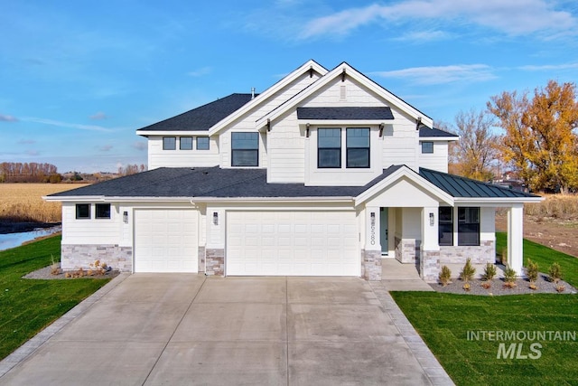 view of front facade with a front yard and a garage