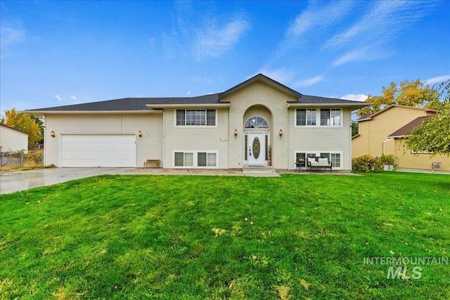 split foyer home with a front yard and a garage