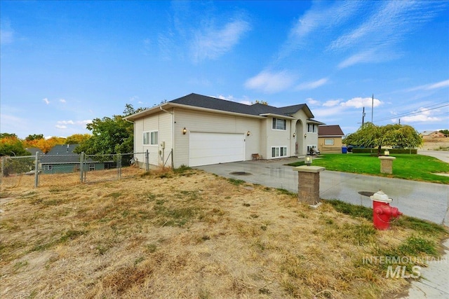 view of side of home with a garage and a lawn