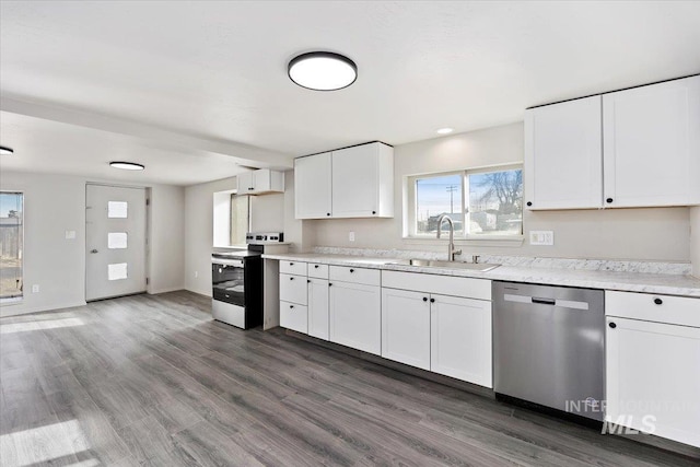 kitchen featuring dark wood-style flooring, a sink, range with electric stovetop, dishwasher, and white cabinets