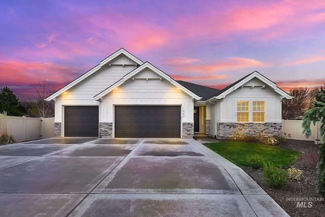 1440 E Azan St, Meridian, ID 83646 - craftsman inspired home featuring driveway, stone siding, fence, and an attached garage