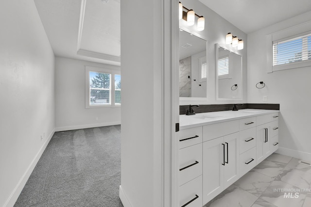 1440 E Azan St, Meridian, ID 83646 - bathroom with marble finish floor, double vanity, baseboards, and a sink