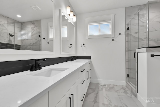 1440 E Azan St, Meridian, ID 83646 - full bathroom featuring baseboards, a stall shower, visible vents, marble finish floor, and a sink