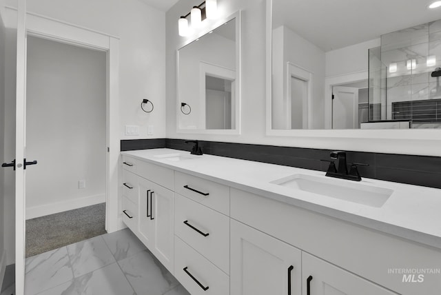1440 E Azan St, Meridian, ID 83646 - bathroom featuring double vanity, a tile shower, marble finish floor, and a sink