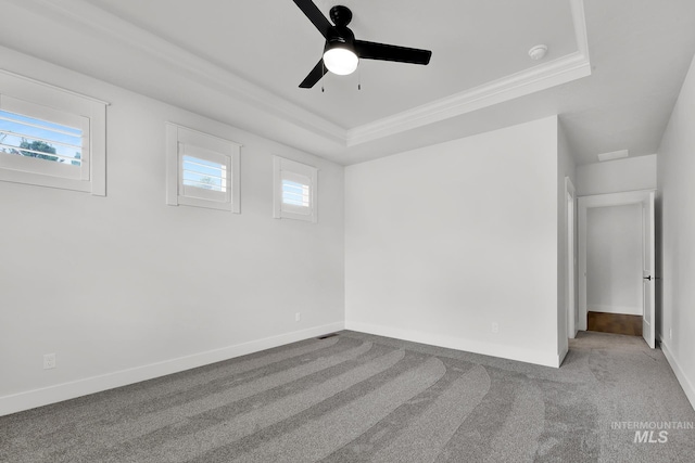 1440 E Azan St, Meridian, ID 83646 - interior space with a raised ceiling, a healthy amount of sunlight, a ceiling fan, and carpet floors