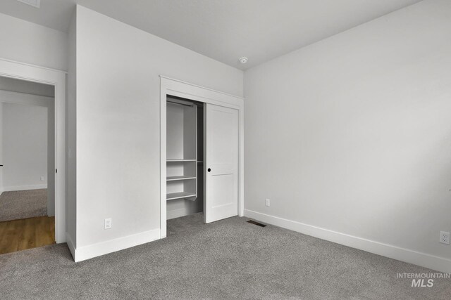 1440 E Azan St, Meridian, ID 83646 - unfurnished bedroom with carpet flooring, visible vents, a closet, and baseboards