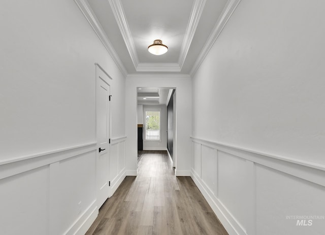1440 E Azan St, Meridian, ID 83646 - hallway with a decorative wall, crown molding, a tray ceiling, wood finished floors, and a wainscoted wall