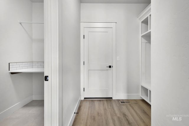 1440 E Azan St, Meridian, ID 83646 - interior space with visible vents, baseboards, and wood finished floors