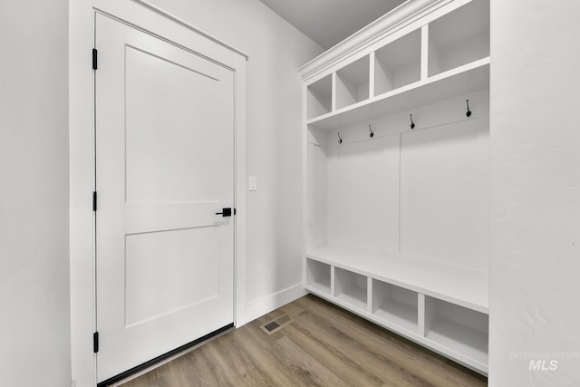 1440 E Azan St, Meridian, ID 83646 - mudroom with visible vents, baseboards, and wood finished floors