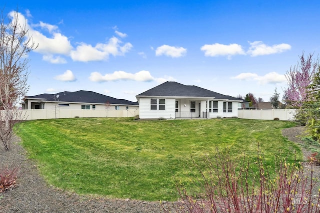 1440 E Azan St, Meridian, ID 83646 - back of property featuring a fenced backyard and a lawn