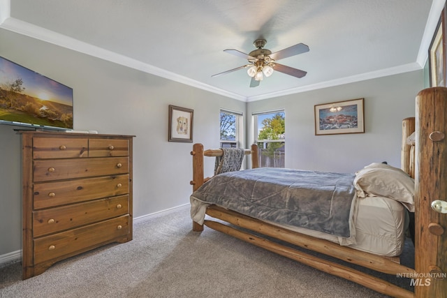 bedroom with ornamental molding, carpet floors, baseboards, and ceiling fan