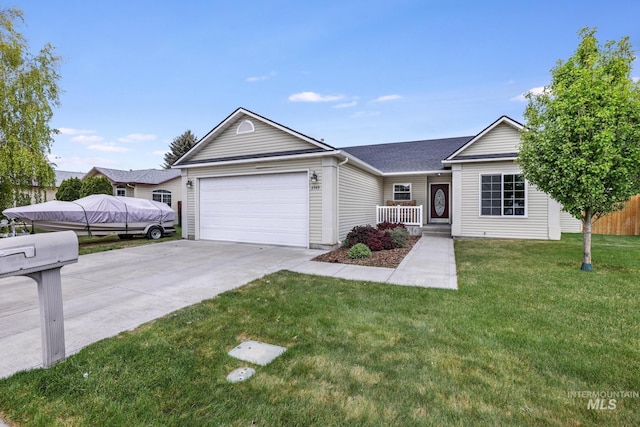 ranch-style house featuring an attached garage, concrete driveway, and covered porch