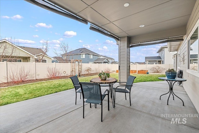 view of patio / terrace with outdoor dining space and a fenced backyard