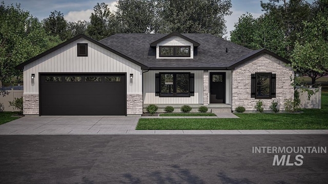 view of front of house featuring a front yard and a garage