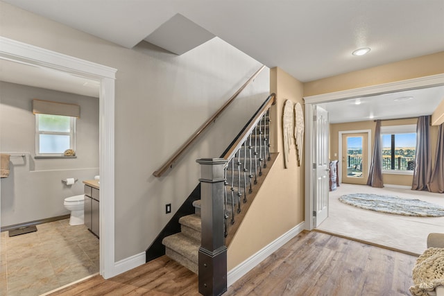 stairway featuring wood-type flooring