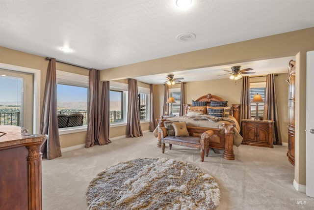 carpeted bedroom featuring access to outside and ceiling fan