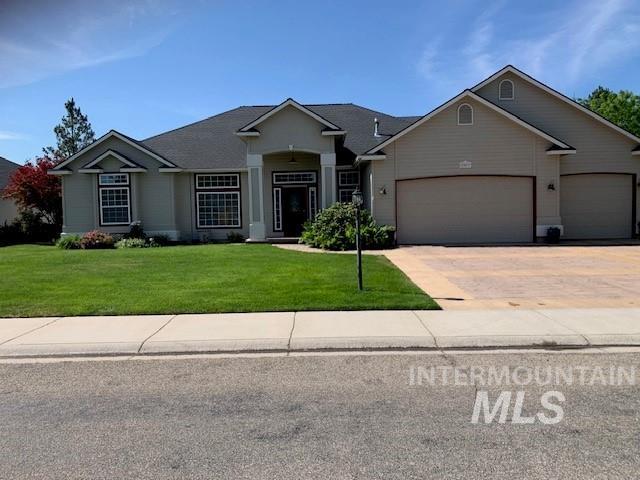 3997 W Harbor Point Dr, Meridian, ID 83646 - ranch-style house with an attached garage, a front lawn, and driveway