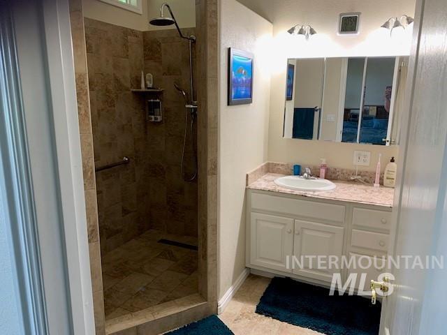 3997 W Harbor Point Dr, Meridian, ID 83646 - full bathroom with vanity and a tile shower