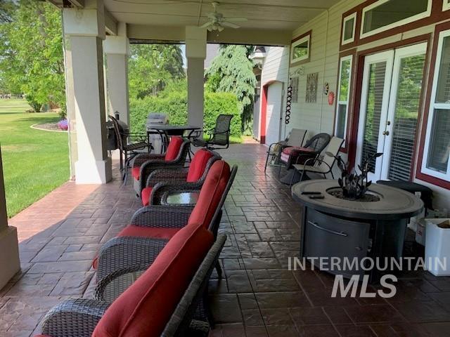 3997 W Harbor Point Dr, Meridian, ID 83646 - view of patio / terrace with ceiling fan, french doors, and outdoor dining area