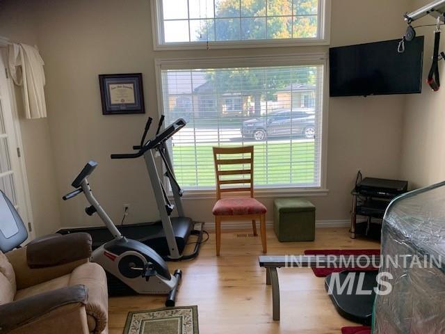 3997 W Harbor Point Dr, Meridian, ID 83646 - workout room with wood finished floors and baseboards