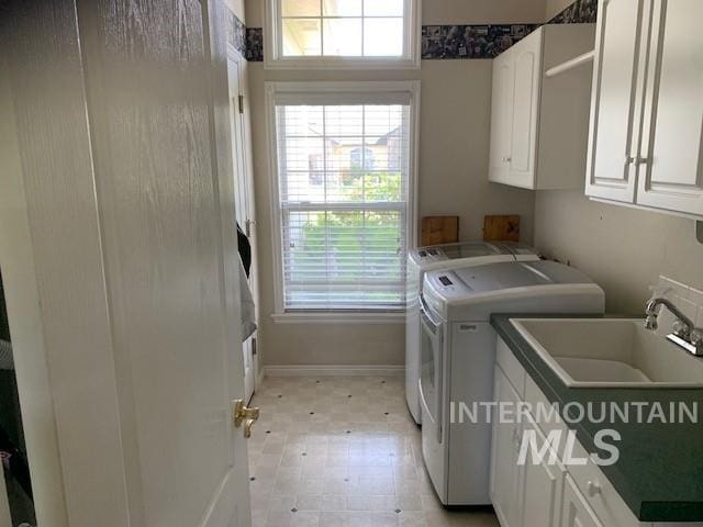 3997 W Harbor Point Dr, Meridian, ID 83646 - washroom with cabinet space, washing machine and clothes dryer, baseboards, and light floors
