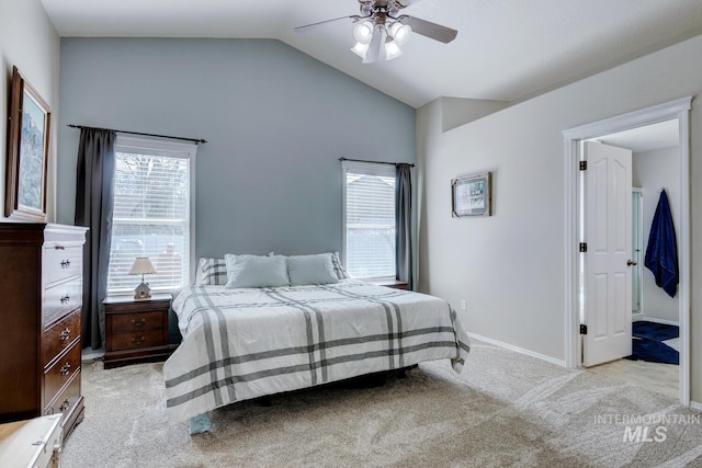 carpeted bedroom with baseboards, a ceiling fan, and vaulted ceiling