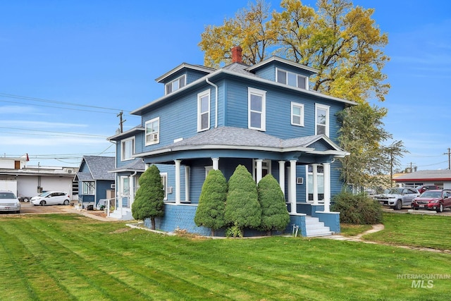 405 N 2nd E, Mountain Home, ID 83647 - american foursquare style home with a front lawn and a chimney